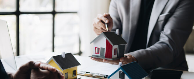 Real-estate agent talking with his customer. moving home or renting property.